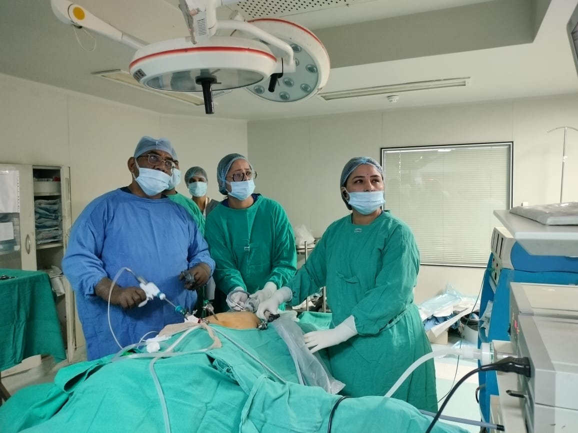 Doctors in surgical scrubs during hands-on laparoscopic workshop